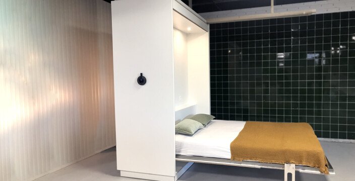 The flexible furniture wall: an innovative urban living project