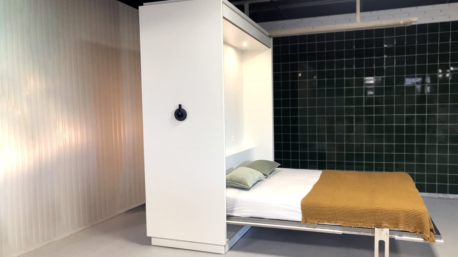 The flexible furniture wall: an innovative urban living project